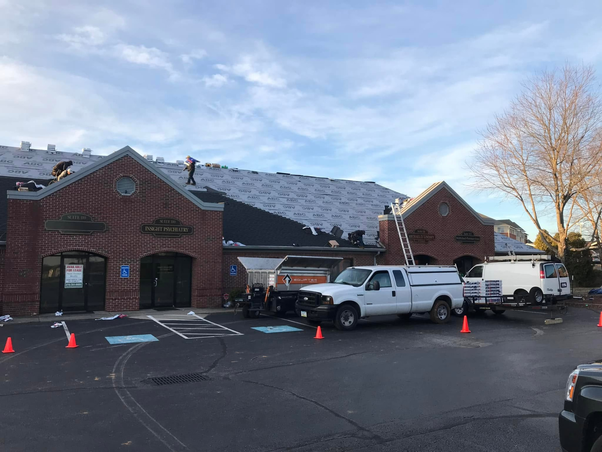 Freedom Contracting crew roofing a commercial property in south-central Kentucky